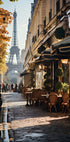 a street with tables and chairs in front of the eiffel tower