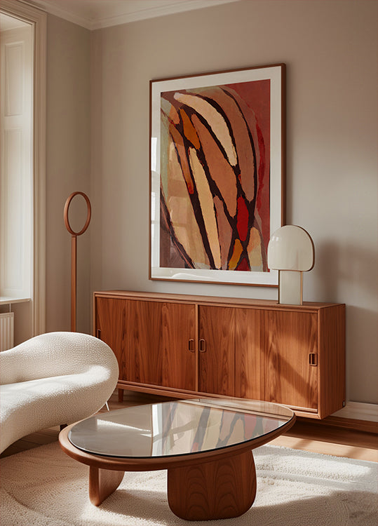 a modern living room with a large abstract painting on the wall, a wooden cabinet, a white sofa, and a glass-topped coffee table.